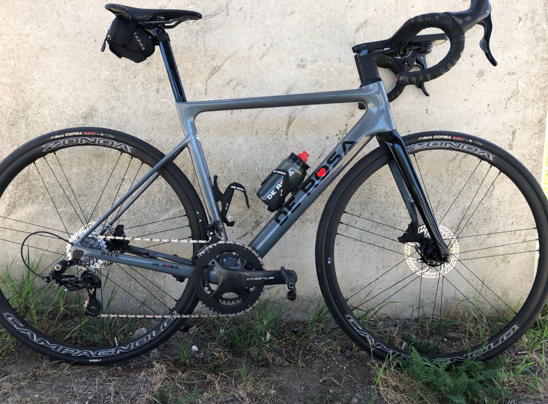 A grey racing bike from the brand De Rosa